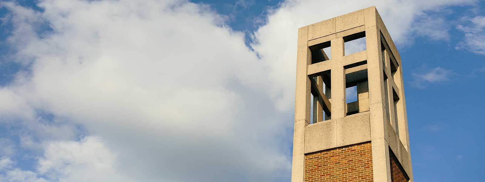 bell tower against blue cloudy sky