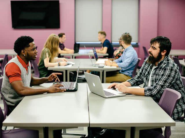 SBU students working on computers in classroom