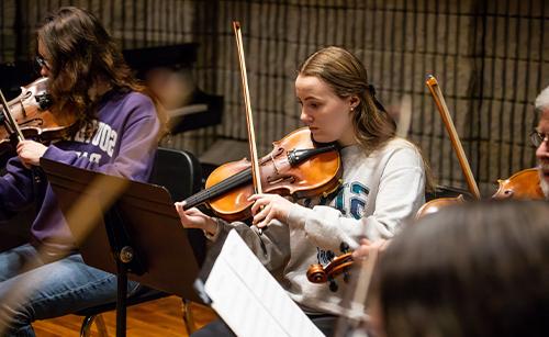students performing in chamber orchestra 