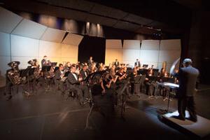 wind symphony performing on stage
